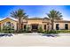 Community clubhouse with attractive landscaping and palm trees at 2310 Hamilton Ridge Rd, Clermont, FL 34715