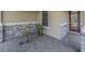Inviting front porch with stone accents and paved flooring at 2310 Hamilton Ridge Rd, Clermont, FL 34715