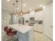 Modern kitchen with white cabinets, quartz counters, and island at 2310 Hamilton Ridge Rd, Clermont, FL 34715