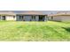 Large backyard showcasing the green lawn and its potential for outdoor activities at 2950 Gibraltar Blvd, New Smyrna Beach, FL 32168