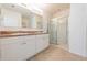 Bathroom with double sink vanity and a glass-enclosed shower for a spa-like experience at 2950 Gibraltar Blvd, New Smyrna Beach, FL 32168