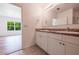 Modern bathroom featuring a double vanity, tiled flooring, and ample space at 2950 Gibraltar Blvd, New Smyrna Beach, FL 32168