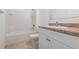 Cozy bathroom featuring a shower-tub combo and vanity with storage at 2950 Gibraltar Blvd, New Smyrna Beach, FL 32168