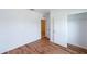 Clean bedroom with wood floors, neutral walls, closet and interior door at 2950 Gibraltar Blvd, New Smyrna Beach, FL 32168