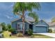 Attractive one-story home featuring a well-maintained lawn, a tasteful exterior, and an attached garage at 2950 Gibraltar Blvd, New Smyrna Beach, FL 32168