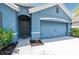 Charming home featuring a well-maintained lawn and an attached two-car garage at 2950 Gibraltar Blvd, New Smyrna Beach, FL 32168
