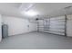 Spacious garage with freshly painted floor and automatic door opener at 2950 Gibraltar Blvd, New Smyrna Beach, FL 32168