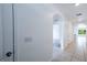 Bright hallway features tiled floors and arched doorways leading to other areas of the home at 2950 Gibraltar Blvd, New Smyrna Beach, FL 32168