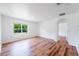 Spacious living room featuring wood flooring and bright natural light at 2950 Gibraltar Blvd, New Smyrna Beach, FL 32168