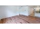 Open-concept living room featuring wood flooring and neutral wall color at 2950 Gibraltar Blvd, New Smyrna Beach, FL 32168