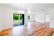 Bright open area with hardwood floors, sliding glass doors, and plenty of natural light at 2950 Gibraltar Blvd, New Smyrna Beach, FL 32168