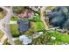 Stunning overhead shot of multiple homes with manicured lawns, swimming pools, and lake access at 301 Richard Pl, Orlando, FL 32806