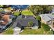 An aerial view of a single-Gathering home featuring a well-manicured lawn, landscaping and backyard at 301 Richard Pl, Orlando, FL 32806