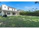 Spacious backyard with a two story home and a fence at 1840 Biscayne Dr, Winter Park, FL 32789