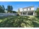 Spacious backyard with a two story home and a fence at 1840 Biscayne Dr, Winter Park, FL 32789