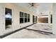 Covered patio with light blue ceiling and access to backyard at 1840 Biscayne Dr, Winter Park, FL 32789