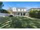 Spacious backyard with a two story home and a fence at 1840 Biscayne Dr, Winter Park, FL 32789