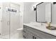 Spa-like bathroom with a glass shower and gray vanity at 1840 Biscayne Dr, Winter Park, FL 32789
