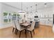 Bright dining area with hardwood floors and kitchen access at 1840 Biscayne Dr, Winter Park, FL 32789