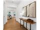 Bright and airy entryway with hardwood floors and stylish decor at 1840 Biscayne Dr, Winter Park, FL 32789