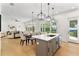 Open concept kitchen with island and view into living room at 1840 Biscayne Dr, Winter Park, FL 32789