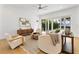 Open living room with hardwood floors and access to backyard at 1840 Biscayne Dr, Winter Park, FL 32789