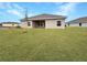 New home with covered patio and spacious backyard at 4376 Sagefield Dr, Harmony, FL 34773