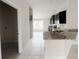 Modern kitchen with granite countertops and dark cabinetry at 4376 Sagefield Dr, Harmony, FL 34773