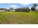 Spacious backyard with green grass and a patio at 7856 Habersham Dr, Lakeland, FL 33810