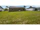 Wide shot of the backyard with lush green grass and no obstructions at 7856 Habersham Dr, Lakeland, FL 33810