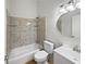 Clean bathroom with tiled shower, modern vanity, and neutral color palette at 7856 Habersham Dr, Lakeland, FL 33810