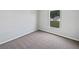 Neutral bedroom with new carpet, natural light, and fresh white trim at 7856 Habersham Dr, Lakeland, FL 33810
