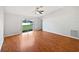 Spacious living room with hardwood floors and sliding glass doors at 7856 Habersham Dr, Lakeland, FL 33810