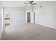 Spacious main bedroom with carpeted floors and ensuite bathroom access at 7856 Habersham Dr, Lakeland, FL 33810