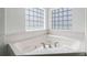 Bathroom featuring a large jacuzzi tub with gold hardware at 9313 Quiet Ln, Winter Garden, FL 34787