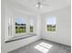 Bright bedroom featuring neutral gray carpet, multiple windows and a window bench seat at 9313 Quiet Ln, Winter Garden, FL 34787