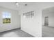 Bright bedroom featuring neutral gray carpet, ceiling fan and large windows letting in natural light at 9313 Quiet Ln, Winter Garden, FL 34787