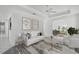 Modern living room with neutral decor, tile floors, and ample natural light at 9313 Quiet Ln, Winter Garden, FL 34787
