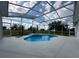 Screened in swimming pool and jacuzzi with landscaping views at 9313 Quiet Ln, Winter Garden, FL 34787