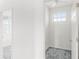 Hallway and small room with a window and gray carpet at 9313 Quiet Ln, Winter Garden, FL 34787
