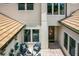 Stylish outdoor patio with a fire pit and seating area and a view of the home's architecture at 10193 Brocksport Cir, Gotha, FL 34734