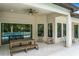 Outdoor patio with a table and bench along with views of a barbecue, the pool and the property's landscaping at 10193 Brocksport Cir, Gotha, FL 34734