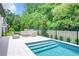 Inviting backyard pool with a deck and comfortable outdoor seating area at 10193 Brocksport Cir, Gotha, FL 34734
