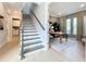 Staircase leading to an upstairs, next to a naturally lit room, perfect for an office at 10193 Brocksport Cir, Gotha, FL 34734