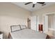 Inviting bedroom with closet and bathroom access, featuring neutral décor at 2877 Attwater Loop, Winter Haven, FL 33884