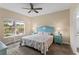 Bedroom featuring a unique, blue seahorse themed headboard and matching side tables at 2877 Attwater Loop, Winter Haven, FL 33884