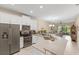 Modern kitchen featuring stainless steel appliances, countertops, and white cabinets at 2877 Attwater Loop, Winter Haven, FL 33884