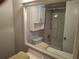 Bathroom featuring a vanity with a large mirror, a toilet, and a shower-tub combination at 1181 Paseo Del Mar # D, Casselberry, FL 32707