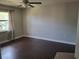 Bedroom with hardwood floors, a ceiling fan, and a window with curtains at 1181 Paseo Del Mar # D, Casselberry, FL 32707