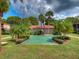Community courtyard featuring palm trees, lush landscaping and open green space at 1181 Paseo Del Mar # D, Casselberry, FL 32707